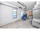 Unfinished garage with AC unit and open garage door at 815 Lantana Ave, Clearwater Beach, FL 33767