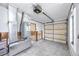 Unfinished garage with AC unit and open garage door at 815 Lantana Ave, Clearwater Beach, FL 33767