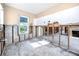A gutted kitchen with exposed walls, pipes, and flooring at 815 Lantana Ave, Clearwater Beach, FL 33767