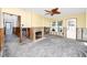 Demolished living room with exposed framing and a fireplace at 815 Lantana Ave, Clearwater Beach, FL 33767
