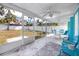 Bright screened porch with seating area at 815 Lantana Ave, Clearwater Beach, FL 33767