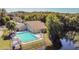 Community pool and clubhouse near lake at 11616 Baywood Meadows Dr # 7, New Port Richey, FL 34654