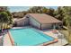 Community pool with surrounding patio and lounge chairs at 11616 Baywood Meadows Dr # 7, New Port Richey, FL 34654