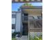 Exterior view of condo building with private entrance and balcony at 11616 Baywood Meadows Dr # 7, New Port Richey, FL 34654