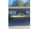 Exterior view showing building and carport at 11616 Baywood Meadows Dr # 7, New Port Richey, FL 34654