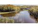 Aerial view of tranquil lake, showcasing its natural beauty at 11616 Baywood Meadows Dr # 7, New Port Richey, FL 34654