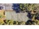 Aerial view of a tennis court in a residential community at 11616 Baywood Meadows Dr # 7, New Port Richey, FL 34654