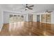 Bright living room with hardwood floors and built-in shelving at 1242 Holiday Dr, Tarpon Springs, FL 34689