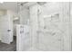 Large walk-in shower with marble tile at 12424 Smith Rd, Dade City, FL 33525