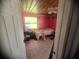 Small bedroom with pink walls and tile floors at 128 18Th Nw St, Ruskin, FL 33570