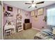 Purple bedroom with vanity and bohemian decor at 13210 Orca Sound Dr, Riverview, FL 33579