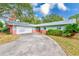 Mid-century ranch home with attached garage at 13211 111Th Ln, Largo, FL 33778