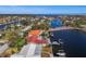 Wide aerial view of property, showcasing the canal and neighborhood at 1998 Massachusetts Ne Ave, St Petersburg, FL 33703