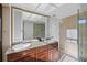 Bathroom with double vanity and large walk-in shower at 1998 Massachusetts Ne Ave, St Petersburg, FL 33703