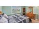 Comfortable guest bedroom with water views and built-in shelving at 1998 Massachusetts Ne Ave, St Petersburg, FL 33703