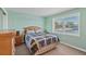 Bedroom with water views and a wooden dresser at 1998 Massachusetts Ne Ave, St Petersburg, FL 33703