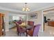 Dining room with glass table and view of living room at 1998 Massachusetts Ne Ave, St Petersburg, FL 33703