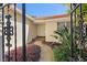 Inviting entryway with landscaped walkway and decorative iron gate at 1998 Massachusetts Ne Ave, St Petersburg, FL 33703
