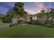 Single-story home with attractive landscaping and a two car garage at 1998 Massachusetts Ne Ave, St Petersburg, FL 33703