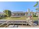 Back exterior showcasing a screened patio and canal views at 1998 Massachusetts Ne Ave, St Petersburg, FL 33703