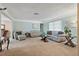 Living Room with light colored couches and large windows at 1998 Massachusetts Ne Ave, St Petersburg, FL 33703