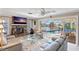 Relaxing living room with fireplace,waterfront view, and sliders to pool area at 1998 Massachusetts Ne Ave, St Petersburg, FL 33703