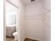 Open shelving in bathroom with toilet and vanity at 20118 Quesada Ave, Port Charlotte, FL 33952