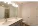 Double vanity bathroom with large mirror and shower at 20118 Quesada Ave, Port Charlotte, FL 33952