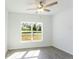 Bedroom with large window and ceiling fan at 20118 Quesada Ave, Port Charlotte, FL 33952