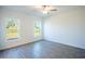 Bright bedroom with ceiling fan and grey tile floors at 20118 Quesada Ave, Port Charlotte, FL 33952