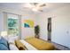 Cozy bedroom with a queen-size bed and window at 20118 Quesada Ave, Port Charlotte, FL 33952