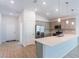 Open concept kitchen with gray cabinets, stainless steel appliances, and island at 20118 Quesada Ave, Port Charlotte, FL 33952