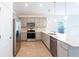 Modern kitchen featuring stainless steel appliances and white quartz countertops at 20118 Quesada Ave, Port Charlotte, FL 33952