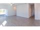 Spacious living room with tile floors and sliding glass doors to the patio at 20118 Quesada Ave, Port Charlotte, FL 33952