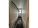 Hallway with dark floor tiles and walls ready for renovation at 2800 47Th S St, Gulfport, FL 33711