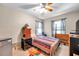 Cozy bedroom featuring a double bed, dresser, and ceiling fan at 3007 56Th S St, Gulfport, FL 33707