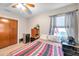 Simple bedroom with double bed, dresser, and ceiling fan at 3007 56Th S St, Gulfport, FL 33707