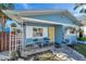 Home's exterior showcasing a yellow door and a porch at 3007 56Th S St, Gulfport, FL 33707