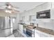 Modern kitchen featuring stainless steel appliances and white cabinets at 3007 56Th S St, Gulfport, FL 33707