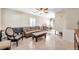 Living room with brown leather couch, coffee table, and ceiling fan at 3007 56Th S St, Gulfport, FL 33707