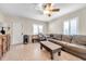 Cozy living room with a brown leather couch and wooden coffee table at 3007 56Th S St, Gulfport, FL 33707