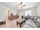 Living room with brown leather sofa and wooden coffee table at 3007 56Th S St, Gulfport, FL 33707