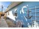 Side yard with a walkway, gravel, and nautical decor at 3007 56Th S St, Gulfport, FL 33707