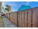 Pathway alongside a wooden fence in the backyard at 3007 56Th S St, Gulfport, FL 33707