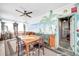Bright sunroom features a tropical mural and ample seating at 3007 56Th S St, Gulfport, FL 33707