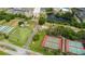 Aerial view of community amenities including tennis courts and driving range at 302 Canton Ct # 56, Sun City Center, FL 33573