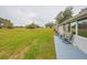Spacious backyard with grassy area and a patio at 302 Canton Ct # 56, Sun City Center, FL 33573