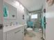 Updated bathroom with walk-in shower and modern vanity at 302 Canton Ct # 56, Sun City Center, FL 33573