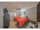 Cozy bedroom with two twin beds, light wood floors, and ceiling fan at 302 Canton Ct # 56, Sun City Center, FL 33573