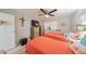 Spacious bedroom with two twin beds, dresser, and ceiling fan at 302 Canton Ct # 56, Sun City Center, FL 33573